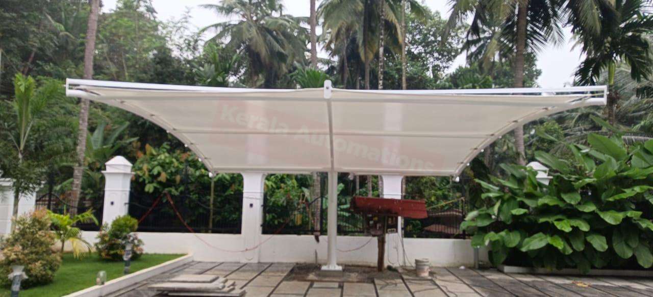 Modern tensile car porch design built in Attingal, Kerala using latest cantilever and roofing styles