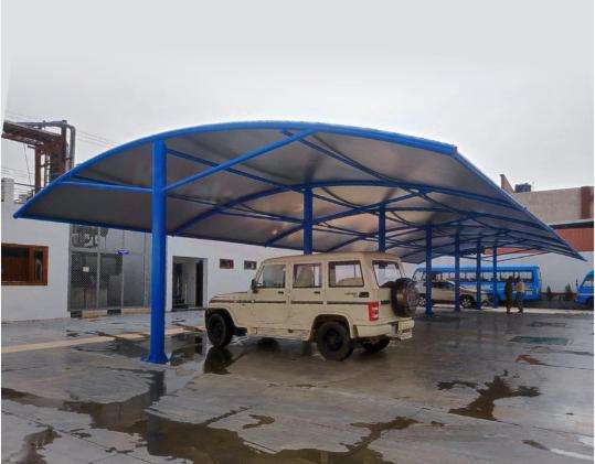Modern tensile car porch design built in Kottayam, Kerala using latest cantilever and roofing styles