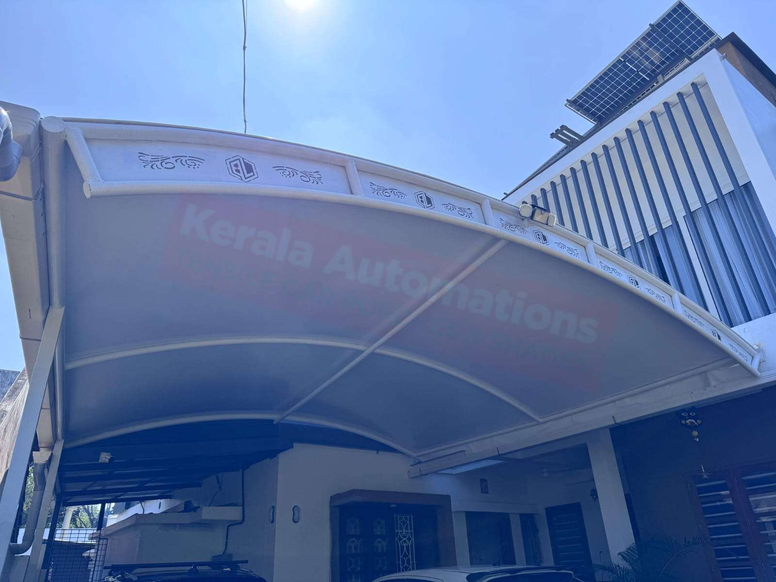 Modern tensile car porch design built in Pothencode, Kerala using latest cantilever and roofing styles